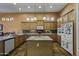 Beautiful kitchen with custom wood cabinets, granite countertops, tile backsplash, and island at 19746 N Heron Ct, Maricopa, AZ 85138