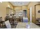 A spacious kitchen includes an island with bar seating and modern appliances at 19746 N Heron Ct, Maricopa, AZ 85138