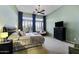 Spacious main bedroom with large windows and comfortable furniture at 19746 N Heron Ct, Maricopa, AZ 85138