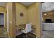 A cozy built-in office nook provides a convenient workspace with natural lighting at 19746 N Heron Ct, Maricopa, AZ 85138