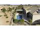 An aerial view of a private pool and pergola in the backyard of a well-maintained home at 19746 N Heron Ct, Maricopa, AZ 85138