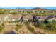 Aerial view of homes showcasing the desert landscaping and mountain views at 2124 N 89Th Pl, Mesa, AZ 85207