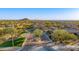 Primary-planned community with desert landscaping, mountain views, and gated entrance at 2124 N 89Th Pl, Mesa, AZ 85207