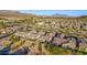 Scenic aerial shot of community homes, mountains, and desert landscaping at 2124 N 89Th Pl, Mesa, AZ 85207