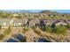 Aerial view of homes showcasing the desert landscaping and mountain views at 2124 N 89Th Pl, Mesa, AZ 85207