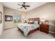 Comfortable bedroom with scenic views from the window and soft lighting at 2124 N 89Th Pl, Mesa, AZ 85207