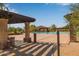 Relaxing pool area featuring a pergola, desert views and plenty of space to lounge at 2124 N 89Th Pl, Mesa, AZ 85207