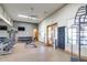 Community gym with weights, machines, mirrors, and natural light for resident fitness at 2124 N 89Th Pl, Mesa, AZ 85207