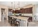 Spacious kitchen featuring a large island with seating, modern appliances, granite counters, and ample cabinet space at 2124 N 89Th Pl, Mesa, AZ 85207