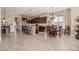 Open-concept kitchen and dining area with tile flooring throughout, perfect for gatherings and everyday living at 2124 N 89Th Pl, Mesa, AZ 85207