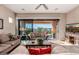 Inviting living room with sliding glass doors to outdoor living space and comfortable couches at 2124 N 89Th Pl, Mesa, AZ 85207