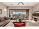 Inviting living room with sliding glass doors to outdoor living space and comfortable couches at 2124 N 89Th Pl, Mesa, AZ 85207