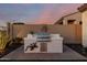 Outdoor grill with decorative lizard and sun decor, on a paver patio, perfect for entertaining at 2124 N 89Th Pl, Mesa, AZ 85207