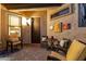 Charming front patio features comfortable seating arrangements, a welcome mat, and lovely decorative accents at 2124 N 89Th Pl, Mesa, AZ 85207