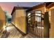 Home patio featuring beautiful tile, dining set, and gate access to courtyard at 2124 N 89Th Pl, Mesa, AZ 85207