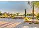 Community pool area with handicap access and shaded seating with views of the desert landscape at 2124 N 89Th Pl, Mesa, AZ 85207