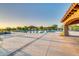 Large community pool featuring covered seating and expansive patio areas for residents at 2124 N 89Th Pl, Mesa, AZ 85207