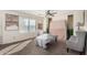Bedroom with a ceiling fan and comfortable seating area at 24207 W Desert Bloom St, Buckeye, AZ 85326