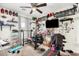 Home gym showcases workout equipment, a ceiling fan, and decor around the room creating an active space at 24207 W Desert Bloom St, Buckeye, AZ 85326