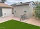 Backyard storage shed, with a patio, lawn, and mature landscaping offering practical and aesthetic appeal at 2710 S Noche De Paz --, Mesa, AZ 85202