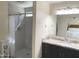 Bathroom featuring a tiled walk-in shower, granite countertop vanity and a large mirror at 2710 S Noche De Paz --, Mesa, AZ 85202