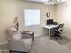 Home office featuring a desk, modern chair, natural light, and a comfortable recliner at 2710 S Noche De Paz --, Mesa, AZ 85202