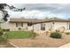 Charming single-story home featuring desert landscaping and a cozy, inviting facade with attached garage at 2710 S Noche De Paz --, Mesa, AZ 85202