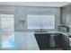 Bright kitchen area with granite countertops, tiled backsplash and view to the outside at 2710 S Noche De Paz --, Mesa, AZ 85202