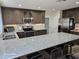 Modern kitchen featuring stainless steel appliances, granite countertops, and ample cabinet space at 2710 S Noche De Paz --, Mesa, AZ 85202