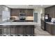 Modern kitchen boasts granite counters, stainless steel appliances, ample storage and bar seating at 2710 S Noche De Paz --, Mesa, AZ 85202