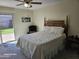 Cozy bedroom with a backyard view, a ceiling fan, and carpeted floor at 2710 S Noche De Paz --, Mesa, AZ 85202