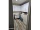 Walk-in pantry provides extra storage with wooden-look flooring and white shelving at 2710 S Noche De Paz --, Mesa, AZ 85202
