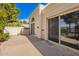 Private back patio with sliding glass doors, offering a peaceful outdoor living space with lake views at 2714 W Desert Cove Ave, Phoenix, AZ 85029