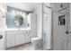 Stylish bathroom with blue accent wall, updated vanity, and a glass-enclosed shower at 2714 W Desert Cove Ave, Phoenix, AZ 85029