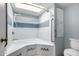 Bright bathroom with skylight, features a bathtub and shower combination at 2714 W Desert Cove Ave, Phoenix, AZ 85029