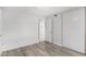 Cozy bedroom with wood-look floors and closet space provides a serene retreat at 2714 W Desert Cove Ave, Phoenix, AZ 85029