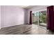 Bright bedroom with wood floors and a large sliding glass door providing access to outdoor area at 2714 W Desert Cove Ave, Phoenix, AZ 85029
