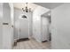 Inviting entryway featuring tile flooring, ample closet space, and a stylish chandelier at 2714 W Desert Cove Ave, Phoenix, AZ 85029