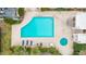 This stunning community pool features a spa, lounge chairs, and plenty of room for recreation at 2714 W Desert Cove Ave, Phoenix, AZ 85029