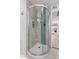 Elegant glass shower showcasing updated tile and built-in niche for bath products at 2714 W Desert Cove Ave, Phoenix, AZ 85029