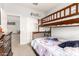 Bedroom with a bunk bed and access to other rooms in the house at 284 N 199Th Dr, Buckeye, AZ 85326