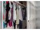 Bedroom closet provides ample storage with various clothing items, promising a well-organized space at 284 N 199Th Dr, Buckeye, AZ 85326