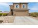 Charming two-story home with a two-car garage and desert landscaping at 284 N 199Th Dr, Buckeye, AZ 85326