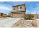 Two-story home with desert landscaping, two-car garage and well-maintained lawn at 284 N 199Th Dr, Buckeye, AZ 85326
