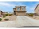 Charming two-story home with a two-car garage and low-maintenance landscaping at 284 N 199Th Dr, Buckeye, AZ 85326