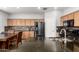 Close-up of a kitchen featuring black appliances, a granite countertop, and wooden cabinets at 284 N 199Th Dr, Buckeye, AZ 85326