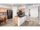 Modern kitchen with stainless steel appliances, a granite countertop island, and nice wood cabinets at 284 N 199Th Dr, Buckeye, AZ 85326