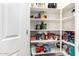 Well-organized and generously sized walk-in pantry with shelving for ample storage space at 284 N 199Th Dr, Buckeye, AZ 85326