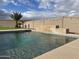 Inviting backyard pool complete with a relaxing water feature at 284 N 199Th Dr, Buckeye, AZ 85326