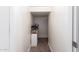 Hallway storage features built-in shelves for organized utility in a well-lit, carpeted space at 284 N 199Th Dr, Buckeye, AZ 85326